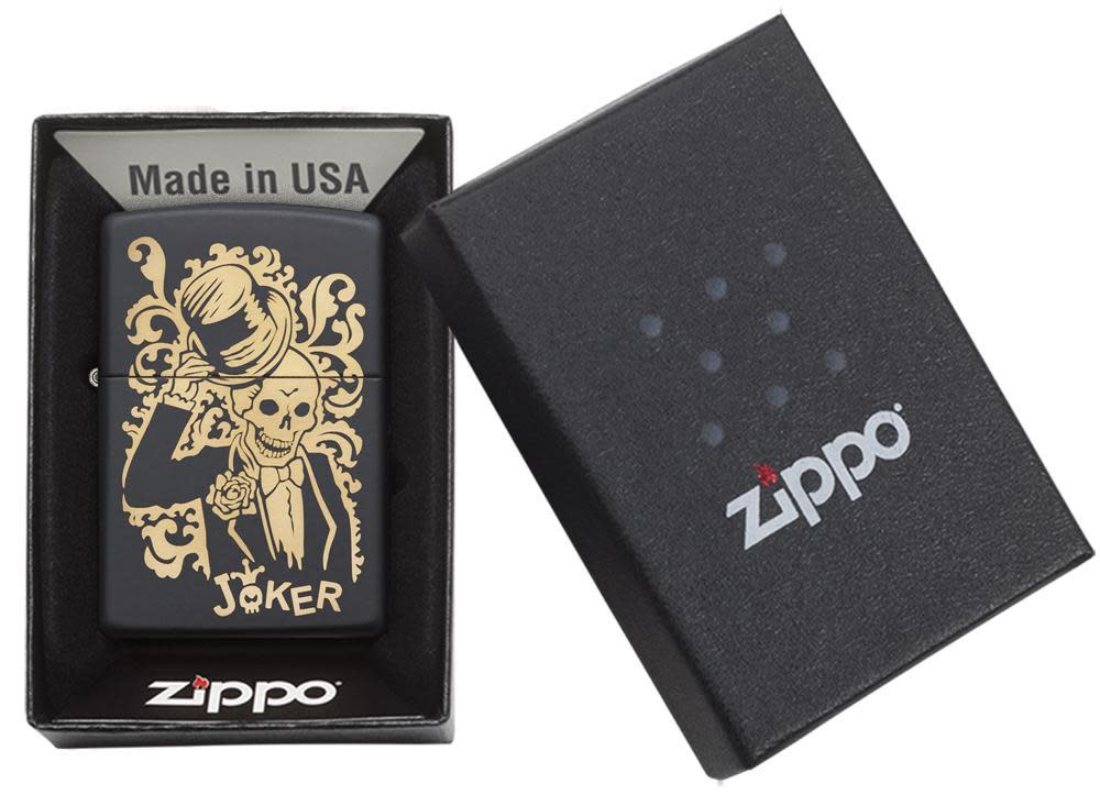 Front view of the Joke Skeleton Tipping Hat with Bronze Swirls on Black Matte Lighter in the one box packaging