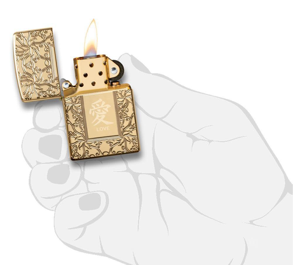 Armor™ High Polish Brass Chinese Love lit in hand
