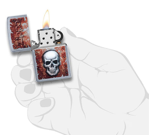 Front view of the Rusted Skull Design Lighter in hand, open and lit