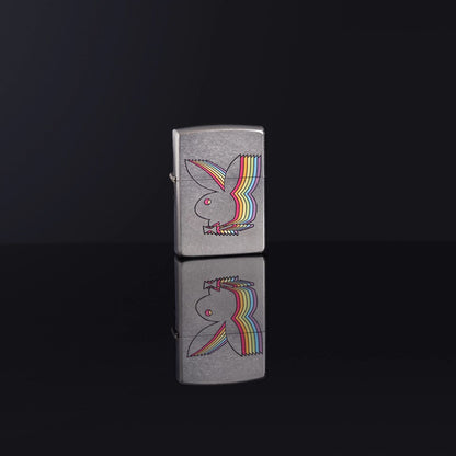 Lifestyle image of Playboy Street Chrome™ Windproof Lighter standing on a black reflective surface