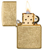 Classic Tumbled Brass Windproof Lighter with its lid open and lit
