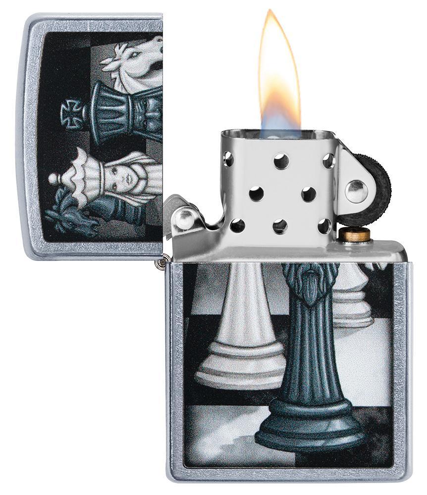 Chess Game Design Street Chrome™ Windproof Lighter with its lid open and lit