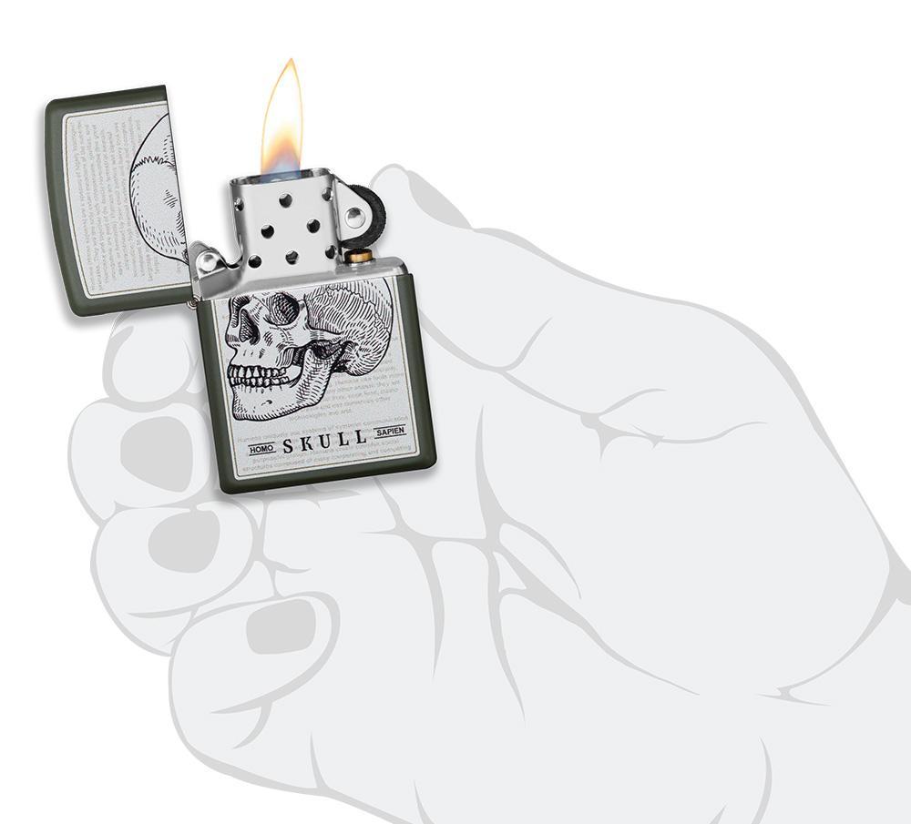 Skull Page Design Green Matte Windproof Lighter lit in hand