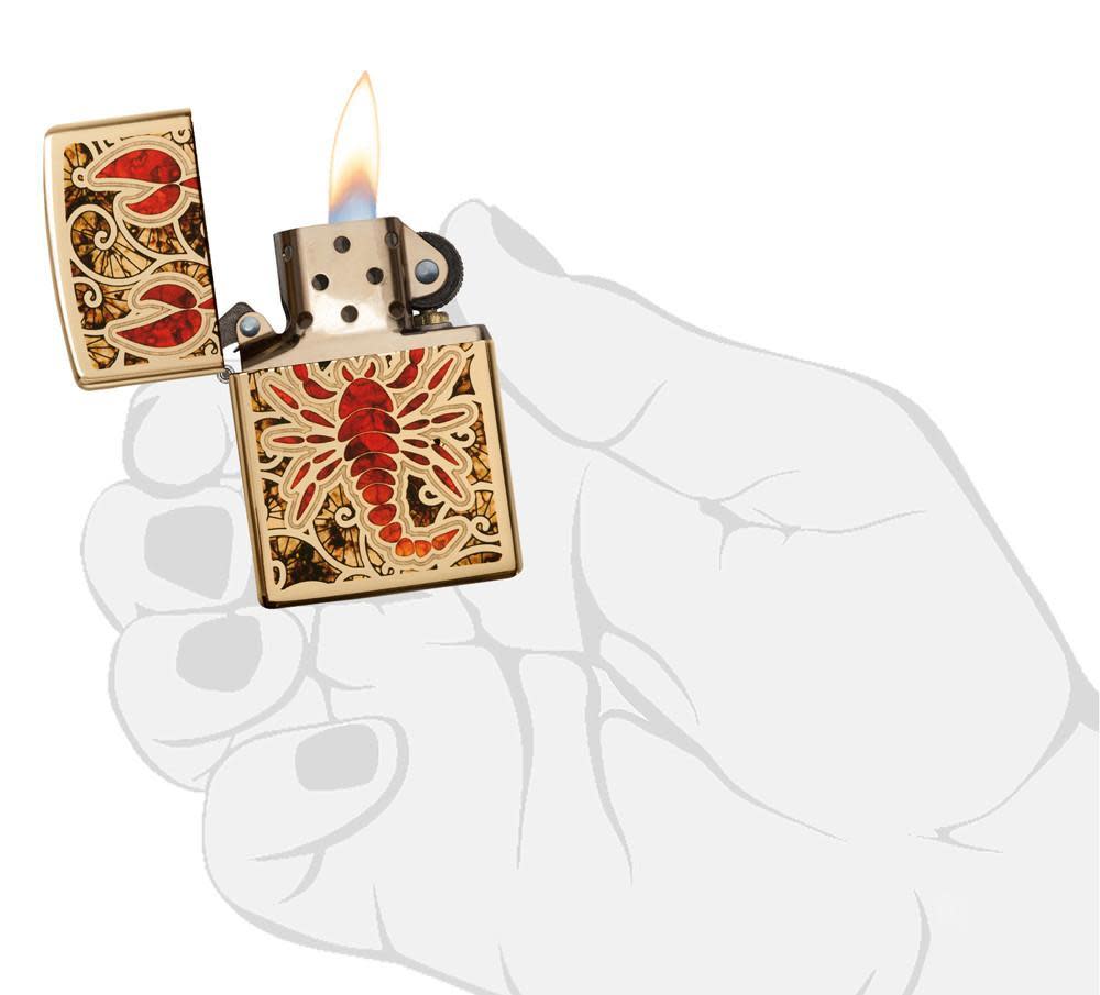 Fusion Scorpion High Polish Brass Windproof Lighter lit in hand