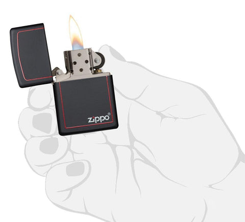 Front view of the Classic Black and Red Zippo Black Matte Lighter, in hand, open and lit