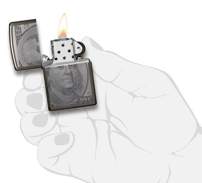 Front view of the Currency Design Lighter open, in hand and lit 