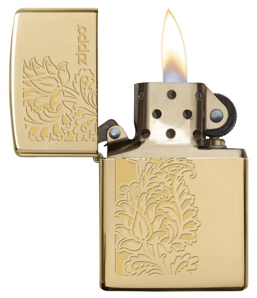 Front view of the Golden Paisley Zippo Design on a High Polish Brass Lighter open and lit