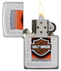 Harley-Davidson High Polish Chrome Windproof Lighter with its lid open and lit