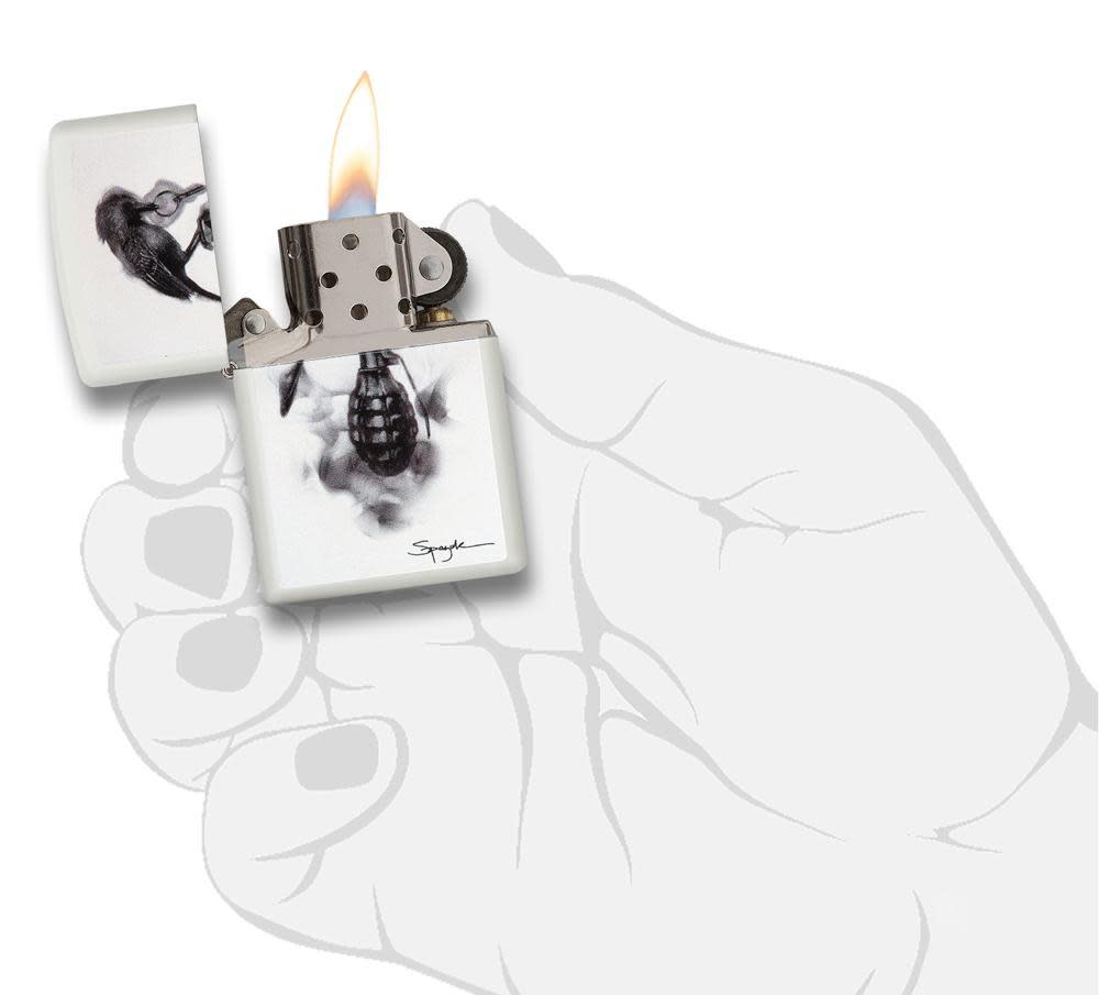 Steven Spazuk Art with Black Bird on Hand Grenade Windproof Lighter in hand