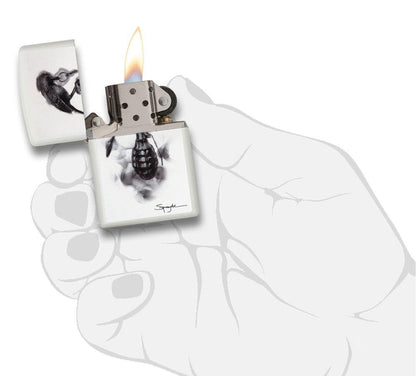 Steven Spazuk Art with Black Bird on Hand Grenade Windproof Lighter in hand