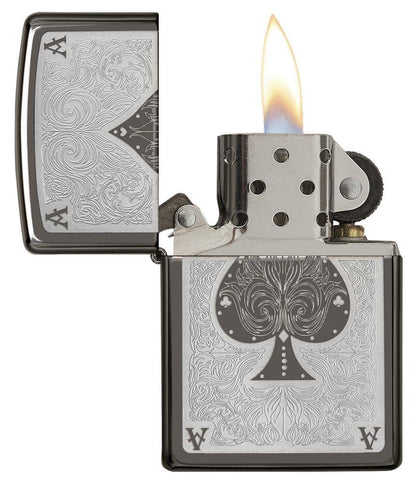 Ace Filigree Engraved Windproof Lighter with its lid open and lit