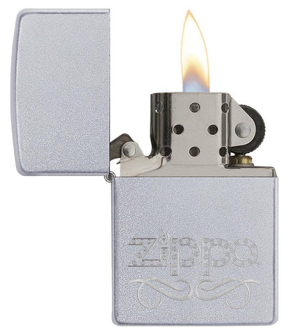 Zippo Scroll Satin Chrome Windproof Lighter with the lid open and lit