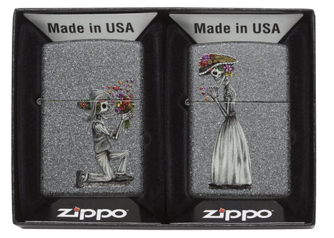 Front view of the Iron Stone Skeleton Husband and Wife Lighters Set of Two in packaging