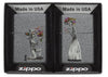 Front view of the Iron Stone Skeleton Husband and Wife Lighters Set of Two in packaging