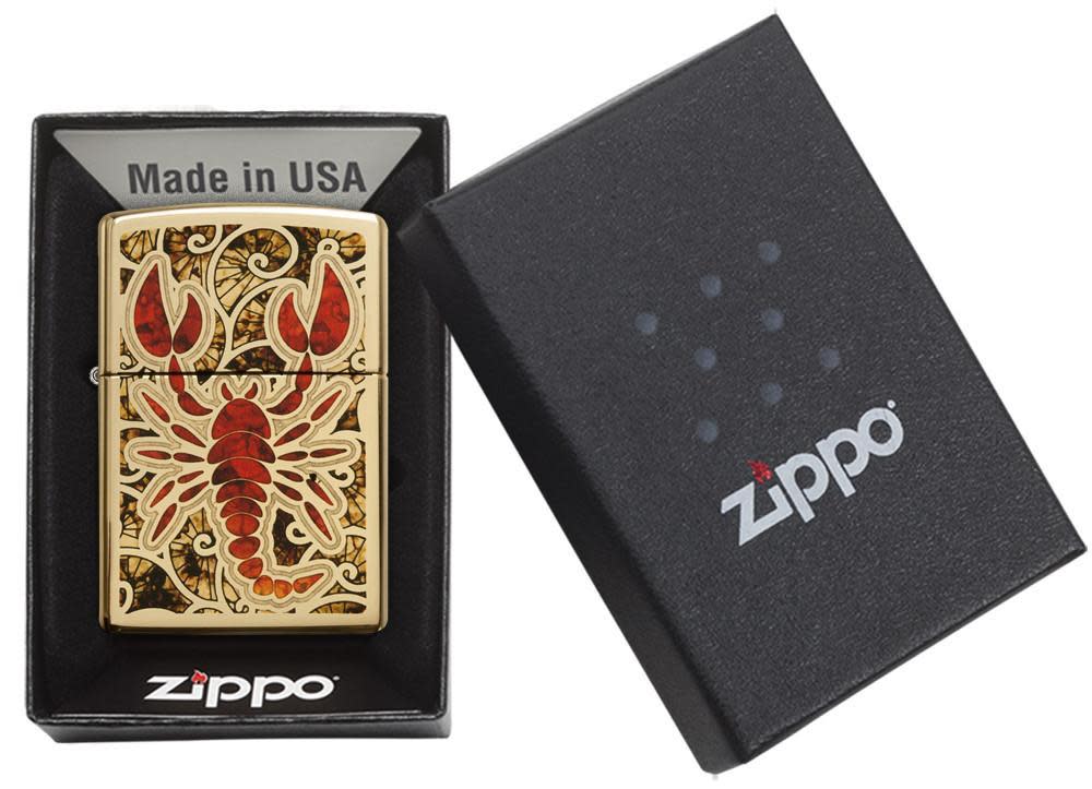 Fusion Scorpion High Polish Brass Windproof Lighter in its packaging