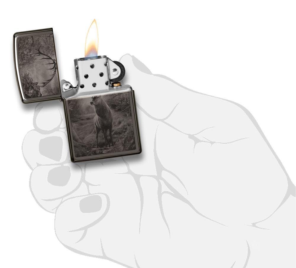Deer Design Black Ice® Lighter lit in hand