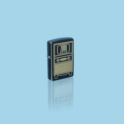 Glamour shot of Zippo Vintage TV Design Black Matte Windproof Lighter standing in a blue scene.
