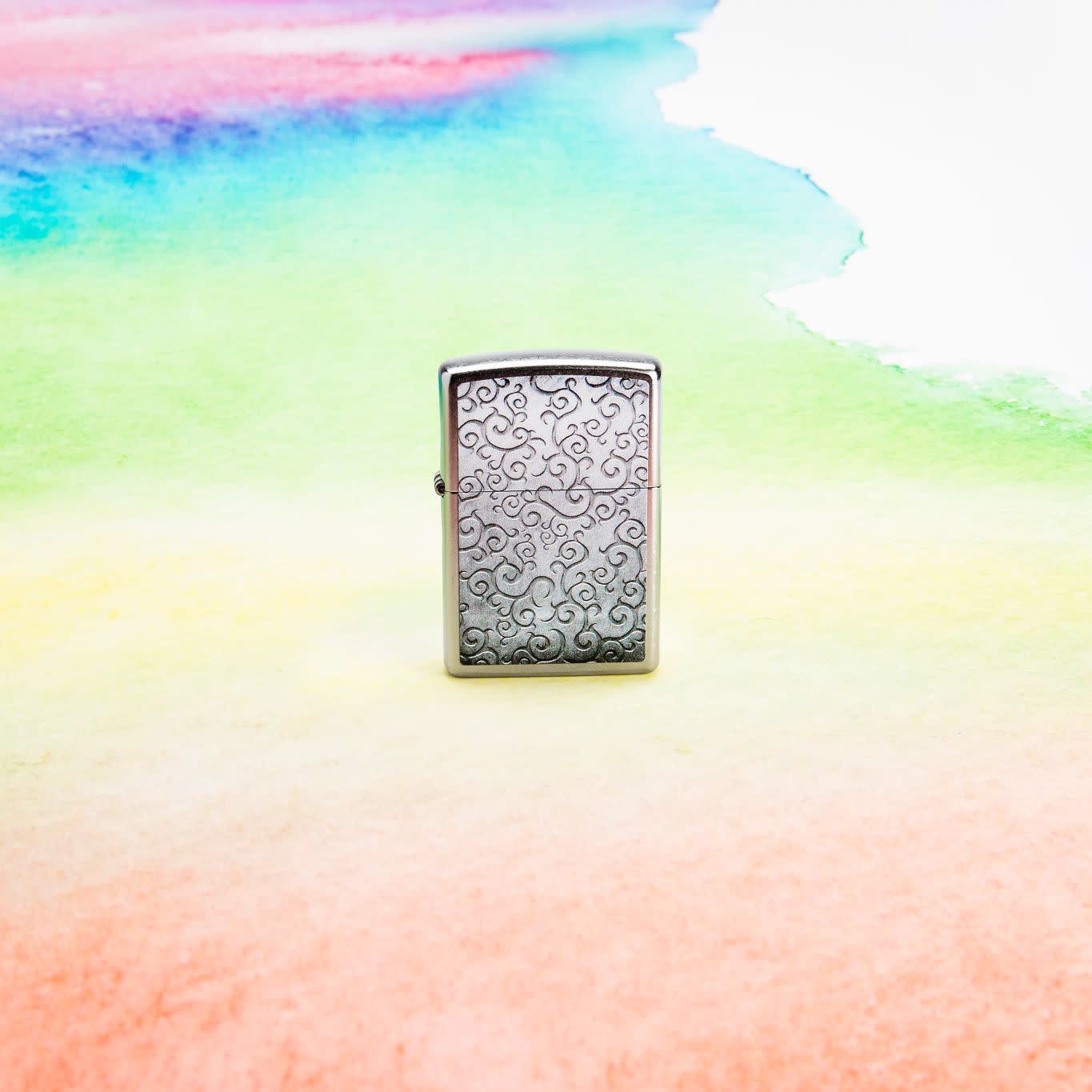 Lifestyle image of Zippo Vines Design Street Chrome Windproof Lighter.