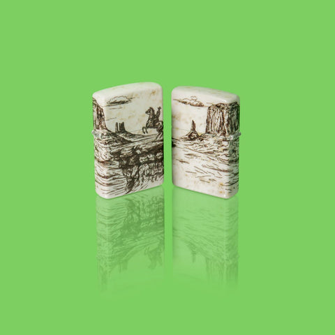 Glamour shot of two Zippo Wild West Scene Design 540 Color Windproof Lighters standing in a green scene.